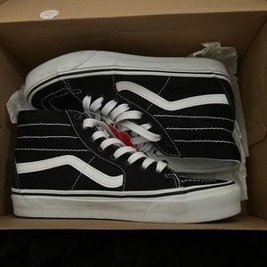 Black and white Sk8-Hi Vans